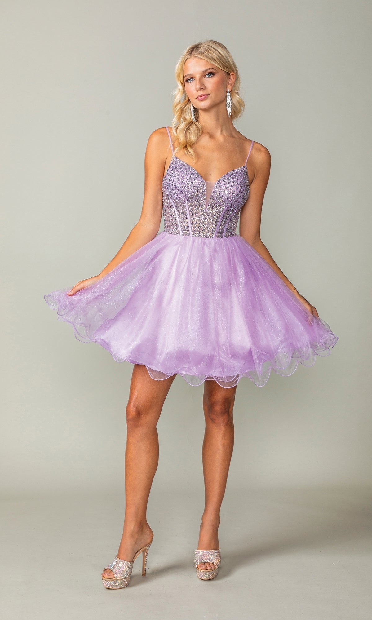 A woman models the Beaded Corset Short A-Line Homecoming Dress 3353, featuring a lilac hue, beaded corset bodice, and flared tulle skirt, standing against a plain background.